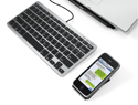 Click to enlarge Slim One Keyboard shown with laptop and iPhone